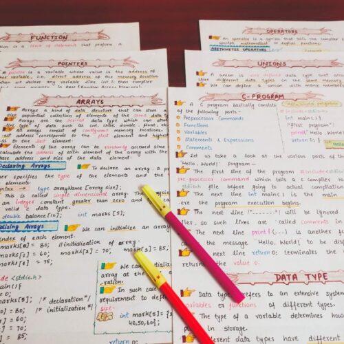 c programming first page with headings of array, union, pointer, function, operators in sample 5 with pink Highlighters include in photo of physical copy kept on wooden desk