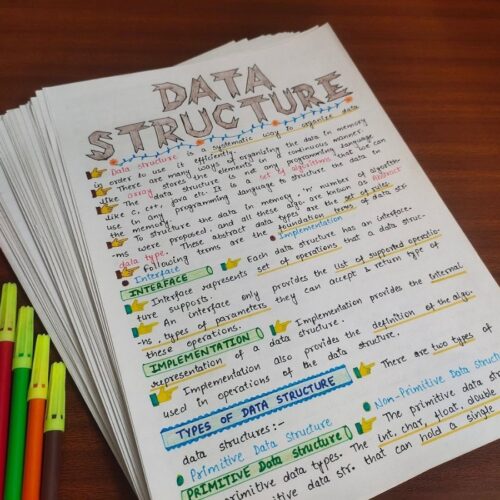 data structures introduction in DSA aesthetic notes sample 4 with creative stuff include in photo of physical copy kept on wooden desk